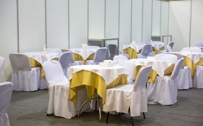 Festive furnitire Festive tables and chairs with white cloths in the hall
